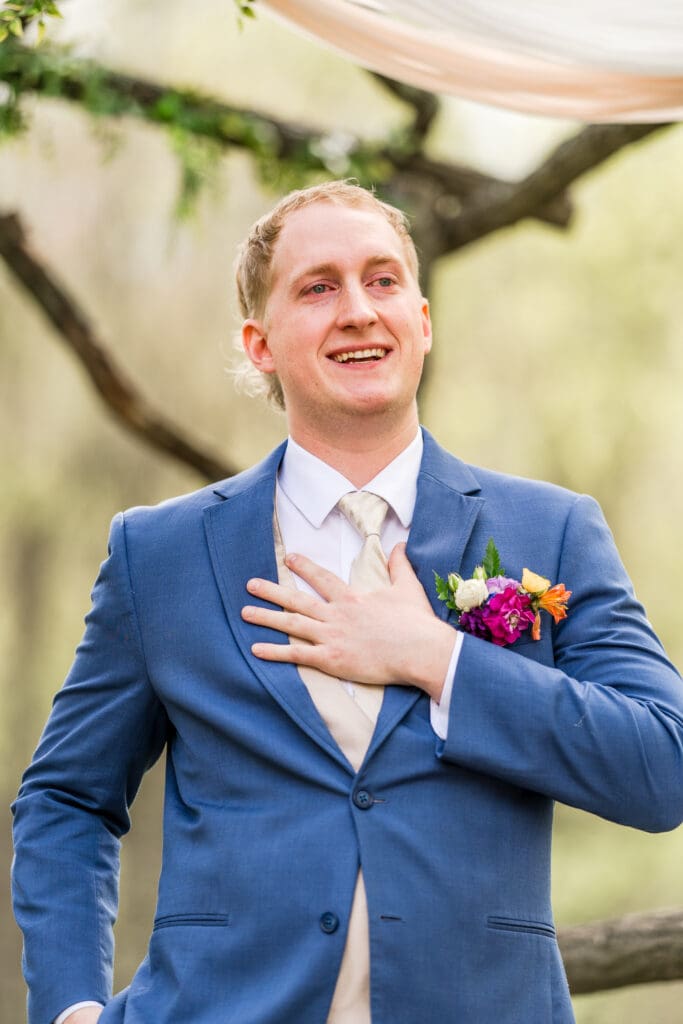 Groom reaction during their wedding at Rivercrest Farms in Dover, Ohio.