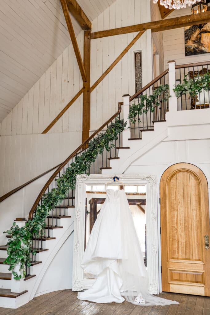 Wedding dress hanging on mirror at Rivercrest Farms in Dover, Ohio.