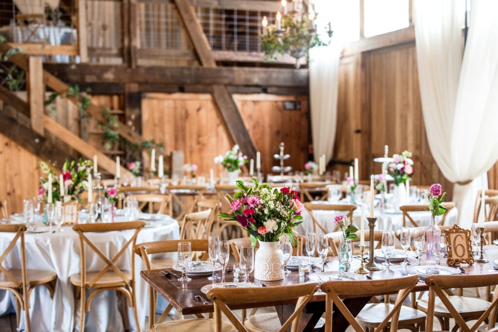 Colorful, rustic garden party themed reception setup at Rivercrest Farms in Dover, Ohio.