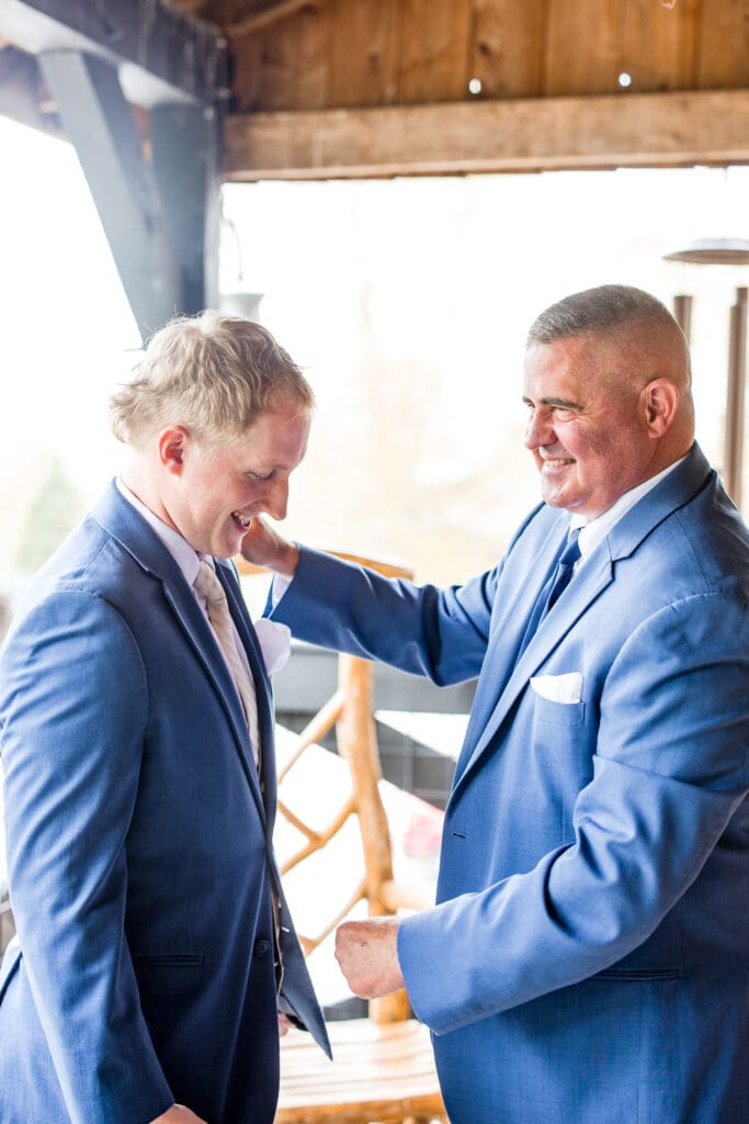 The Groom's dad helping him get ready at Rivercrest Farms in Dover, Ohio.