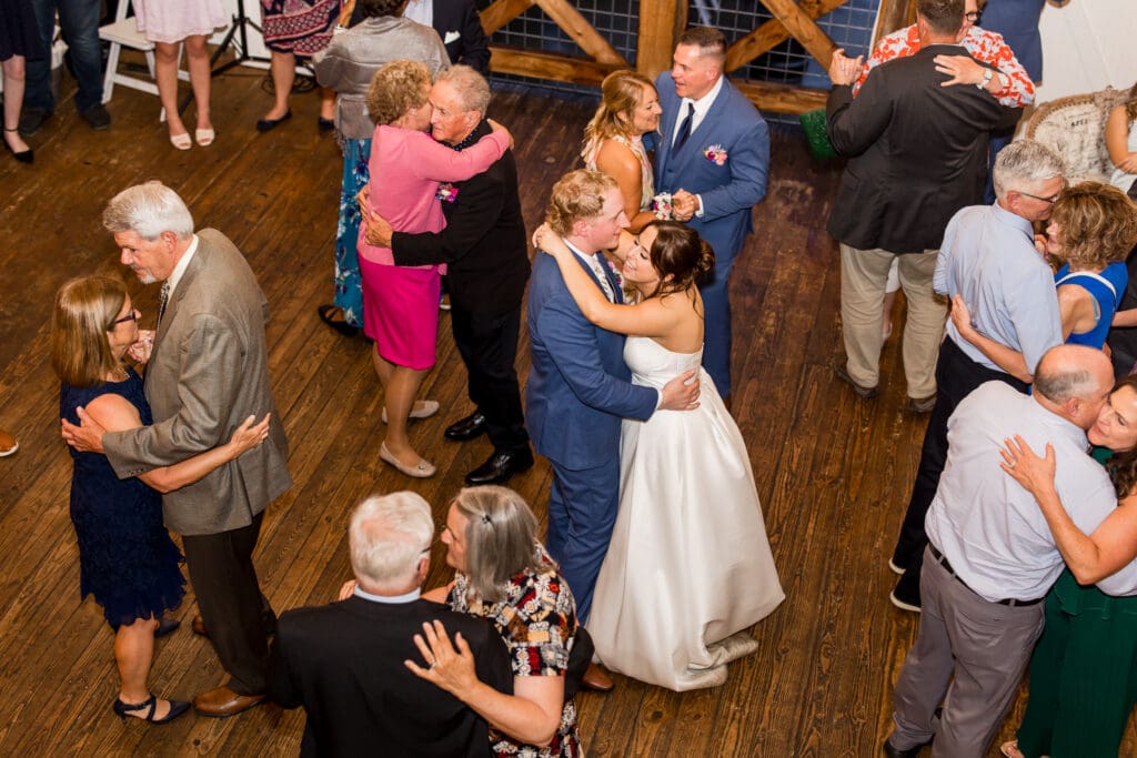 Couple and their guests dance at Rivercrest Farms.