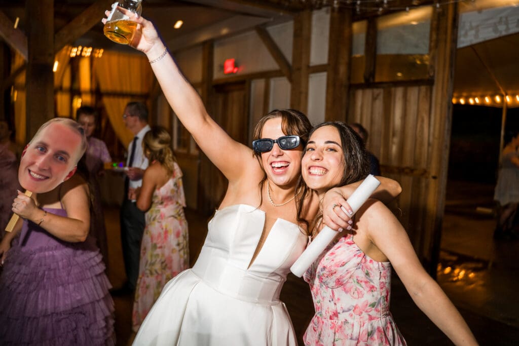 Bride and her sister pose during open dancing.