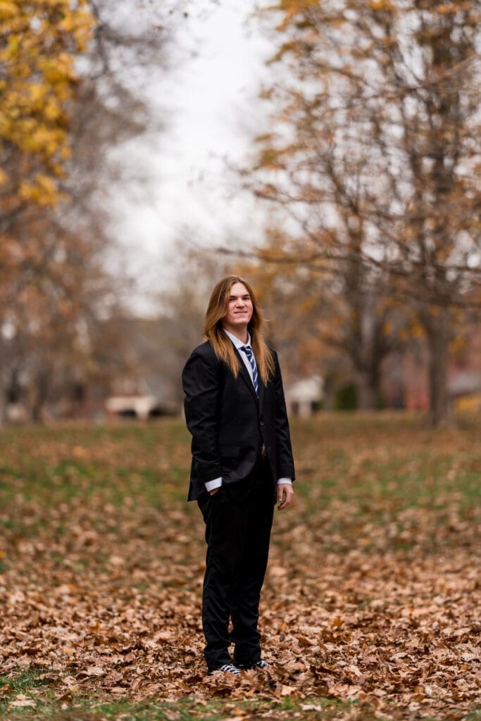 Senior boy in a suit during Fall at Goodale Park in Columbus, Ohio.