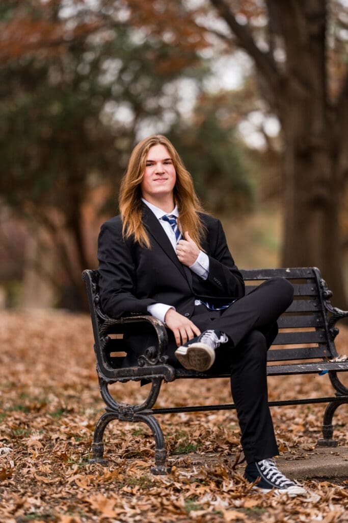 Senior boy in a suit during Fall at Goodale Park in Columbus, Ohio.