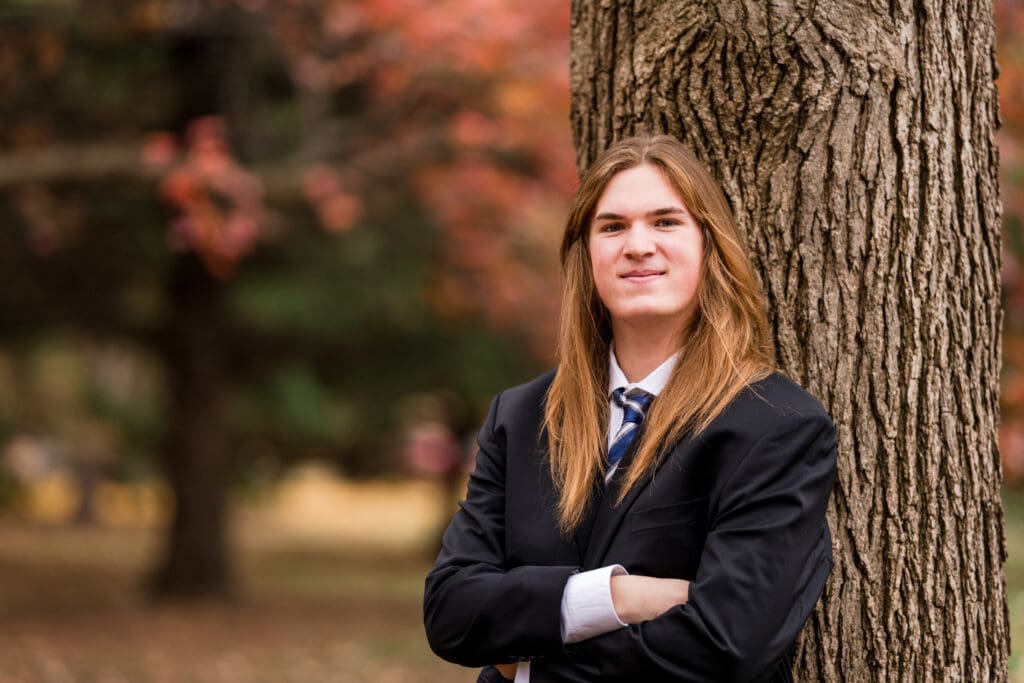 Senior boy in a suit during Fall at Goodale Park in Columbus, Ohio.
