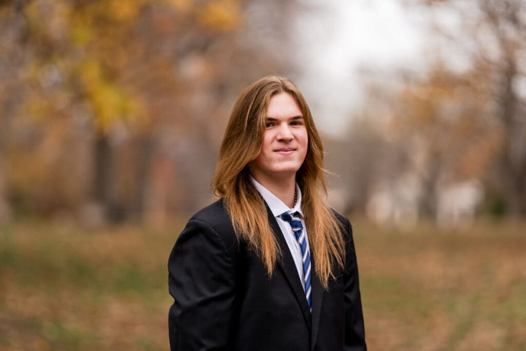 Senior boy in a suit during Fall at Goodale Park in Columbus, Ohio.
