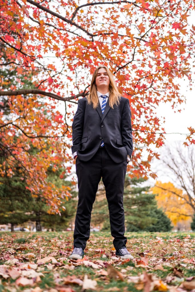 Senior boy in a suit during Fall at Goodale Park in Columbus, Ohio.