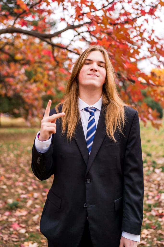 Senior boy in a suit during Fall at Goodale Park in Columbus, Ohio.