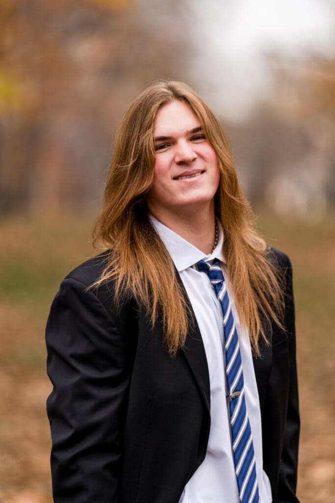 Senior boy in a suit during Fall at Goodale Park in Columbus, Ohio.