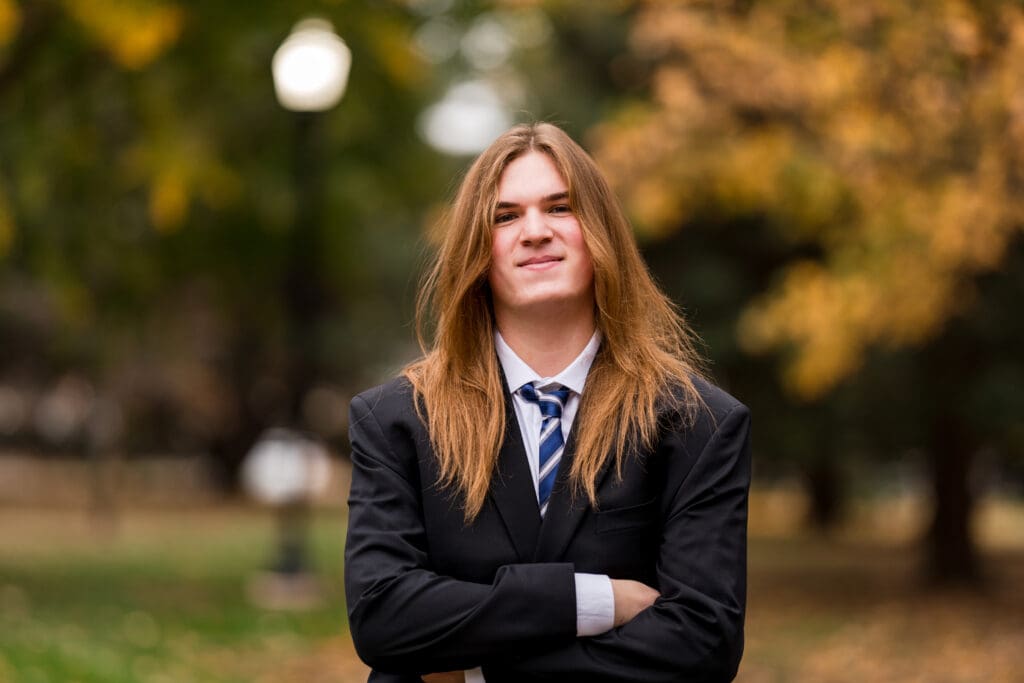 Senior boy in a suit during Fall at Goodale Park in Columbus, Ohio.