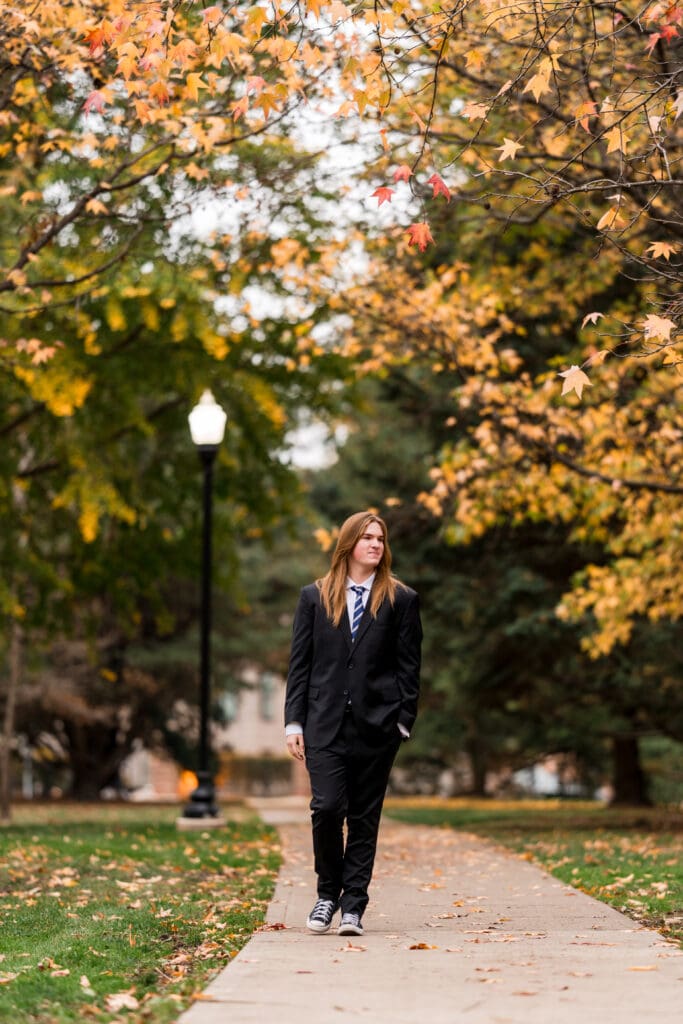 Senior boy in a suit during Fall at Goodale Park in Columbus, Ohio.