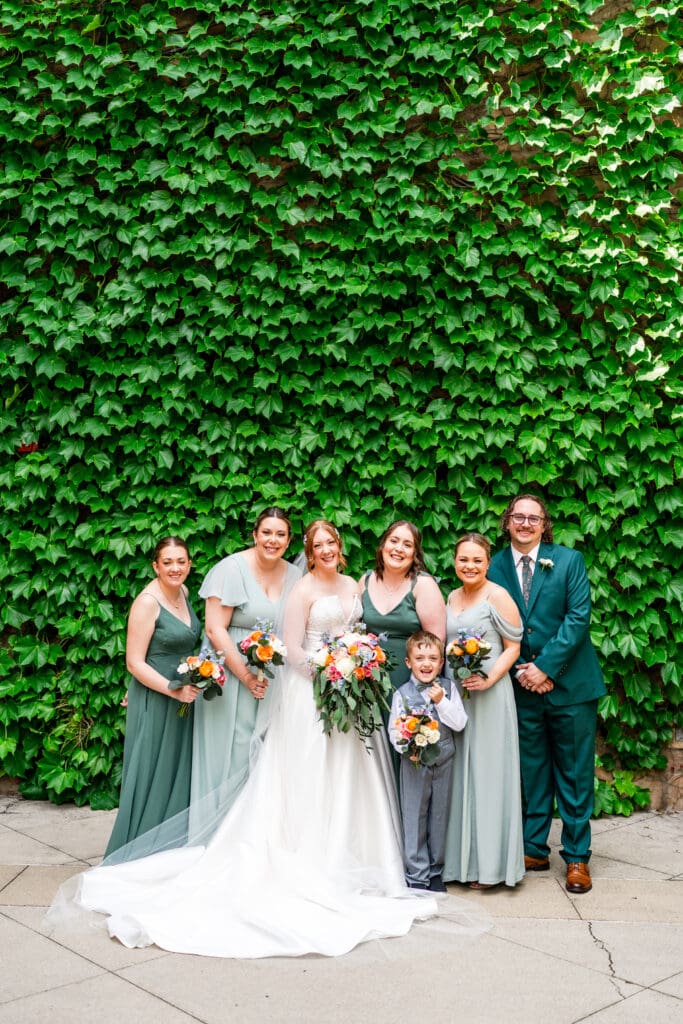 The bride and her wedding party and ring security boy.