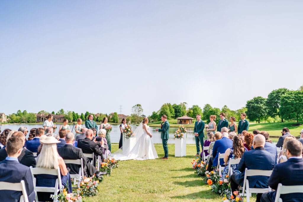 The groom reads his vows at their outdoor ceremony at the Club at Corazon.