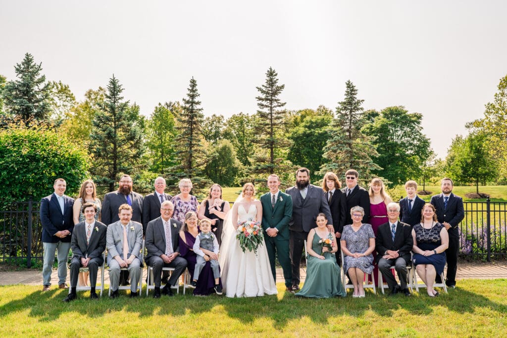 Large family photo of the bride and groom's immediate family and those who traveled in.