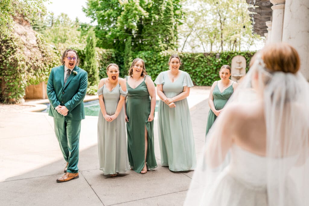 Bridesmaid and groomsmen joyful first look with the bride at the Club at Corazon.