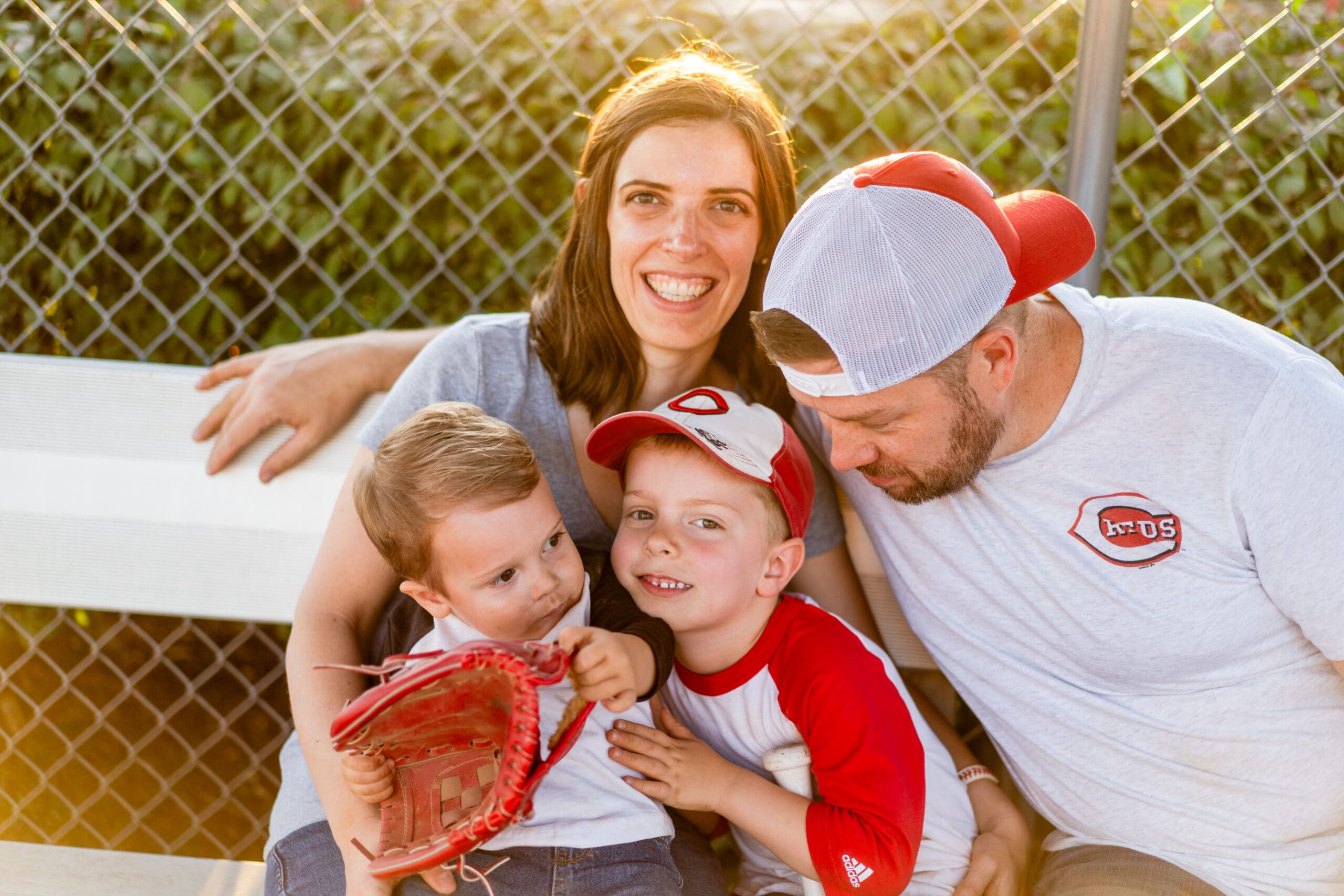 Family sits in the dugout together in Canal Winchester, Ohio.