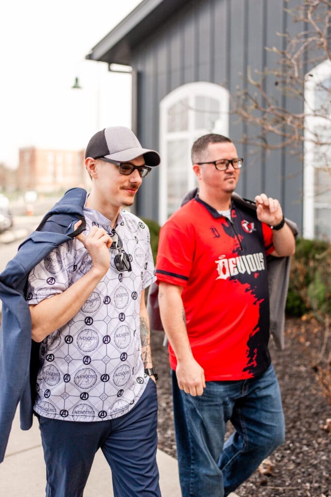 Groom and best man dressed in bowling jerseys arrive to the Estate at New Albany.