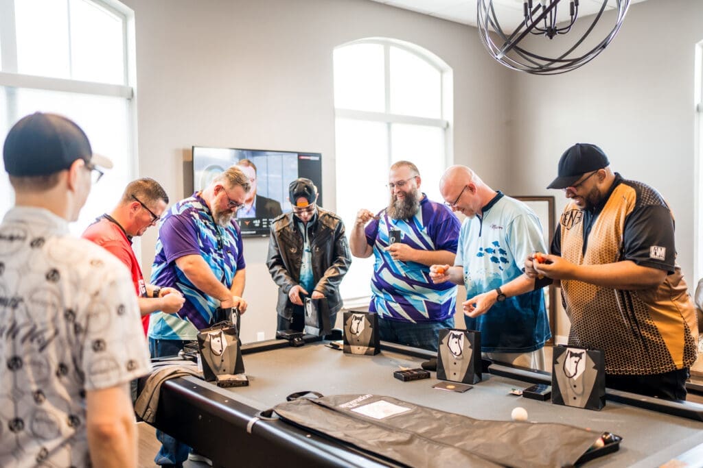 Groomsmen open gifts from groom
