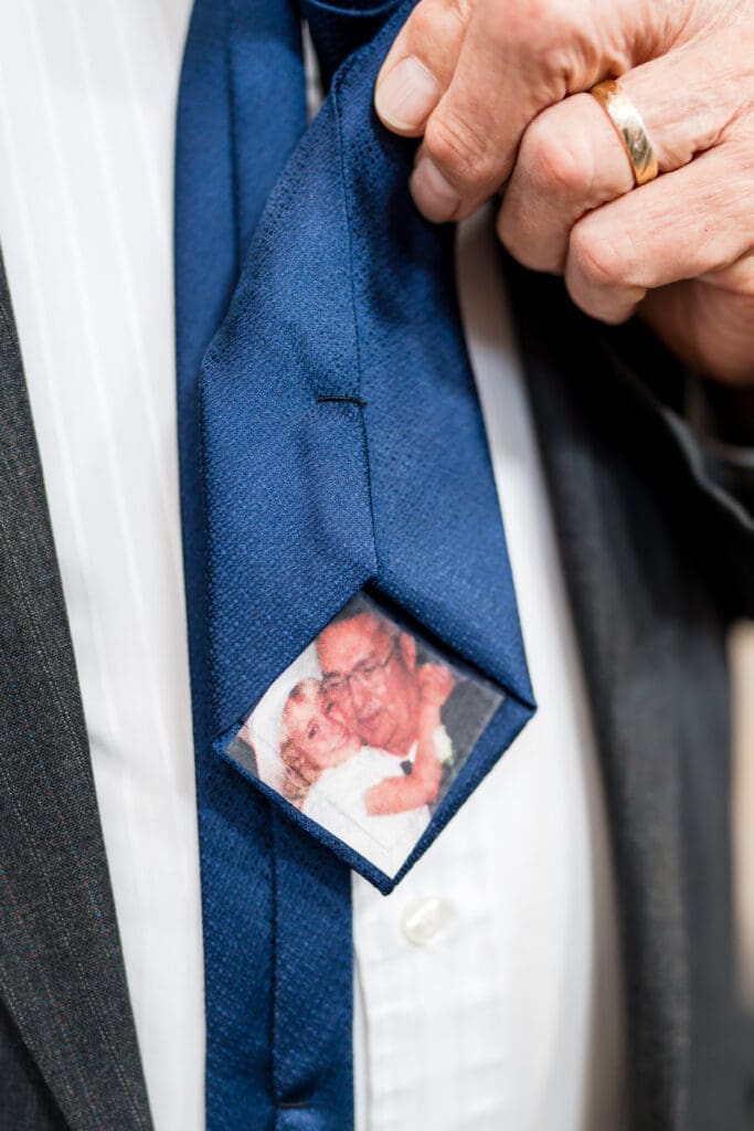 Old photo of the Bride and her grandpa on the back of a tie.