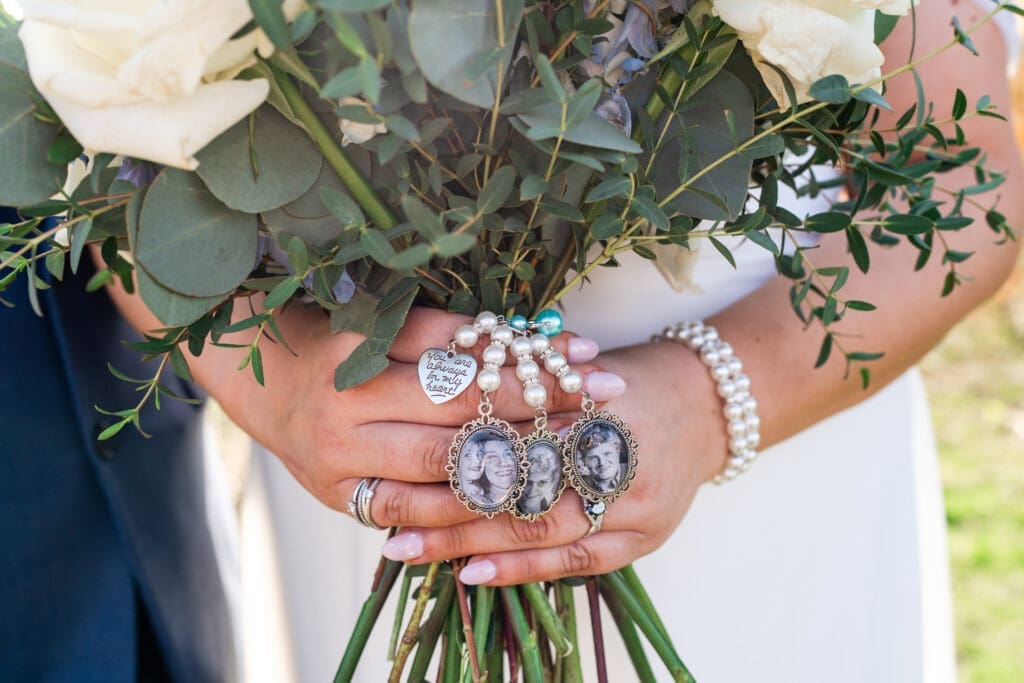 Memorial photos attached to the bride's bouquet