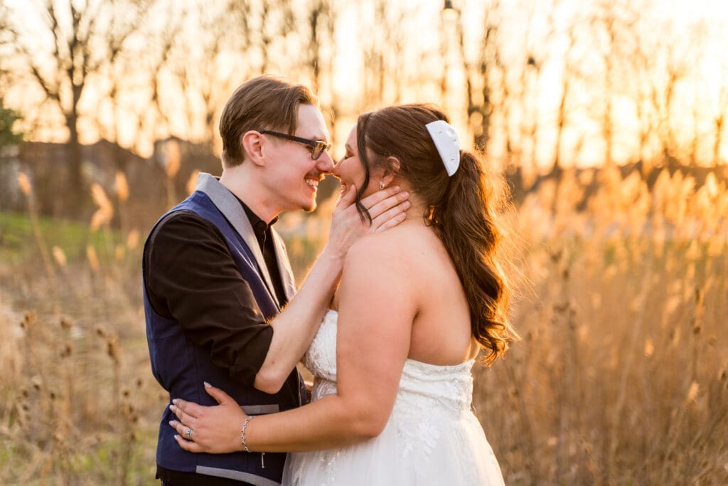 Bride and groom smile at each other during golden hour at the Estate at New Albany