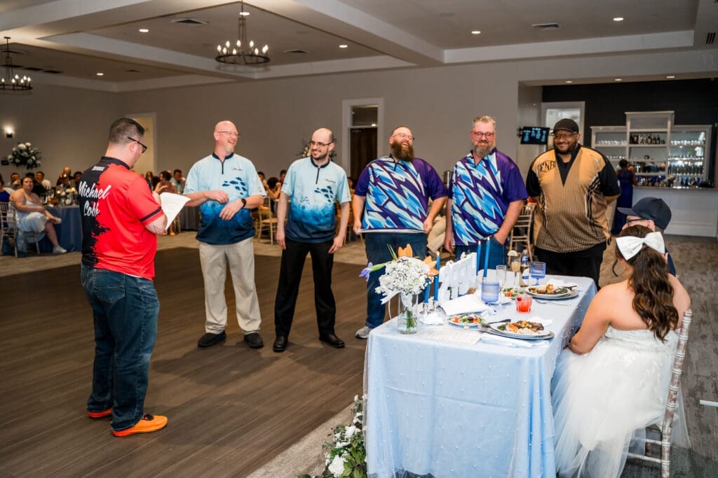 the Best Man gives his toast as the other groomsmen stand there.