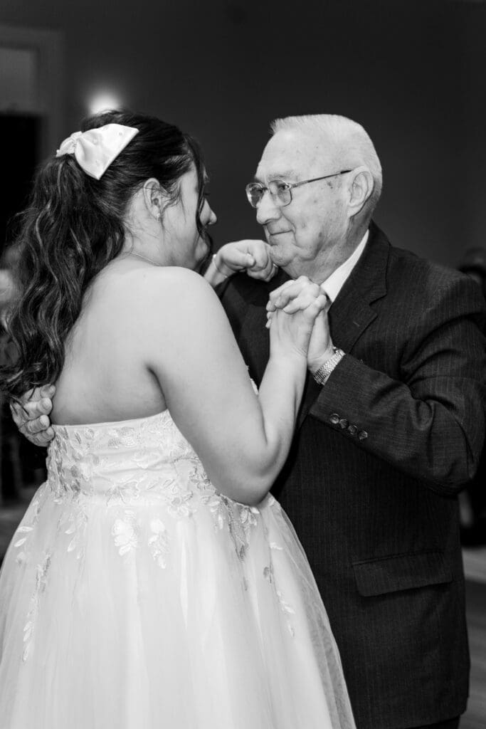 The bride shares a dance with her grandpa at the Estate at New Albany