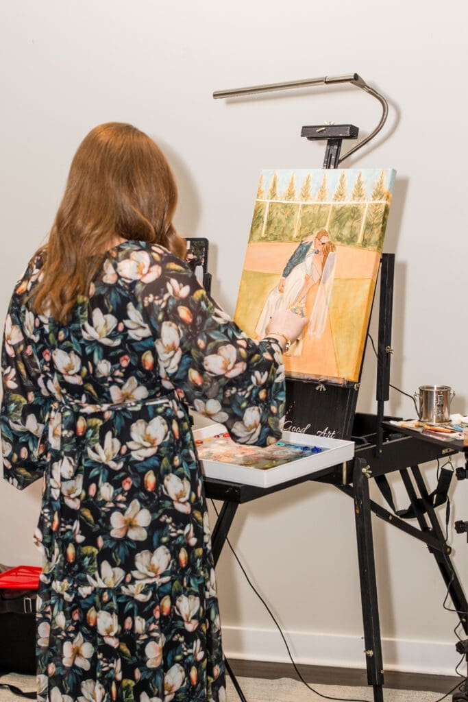 Live painter painting a photo of the couple