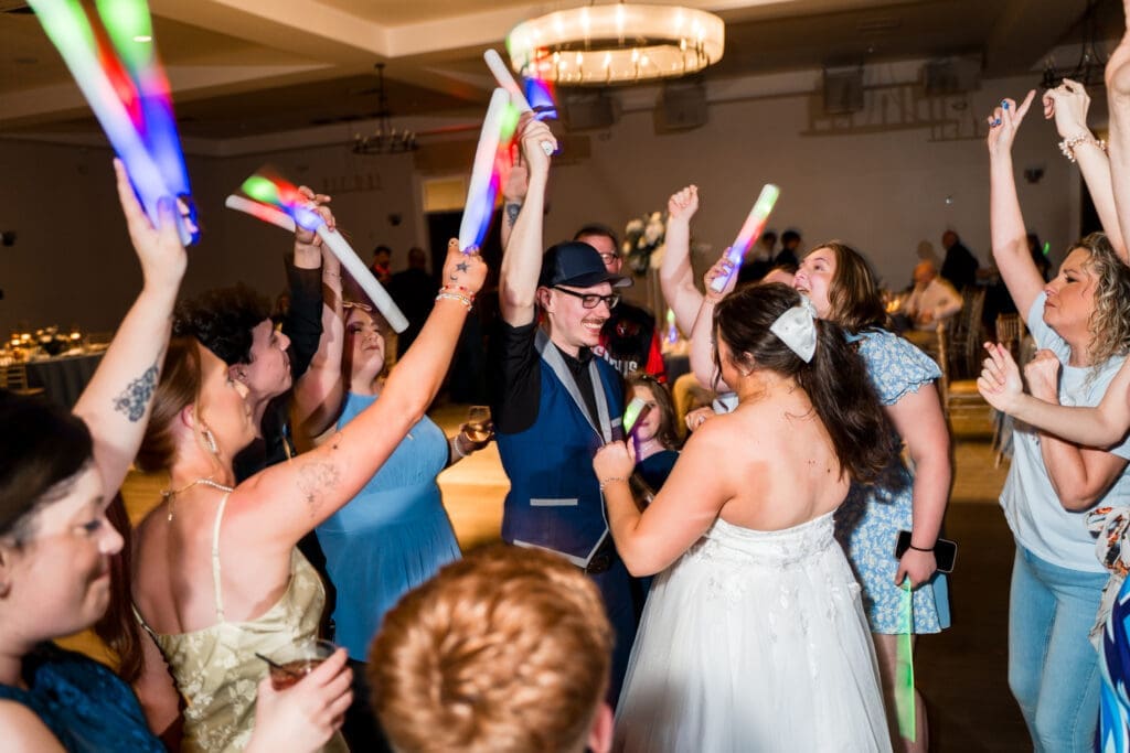 The Couple and their guests dance with glow sticks at the Estate at New Albany