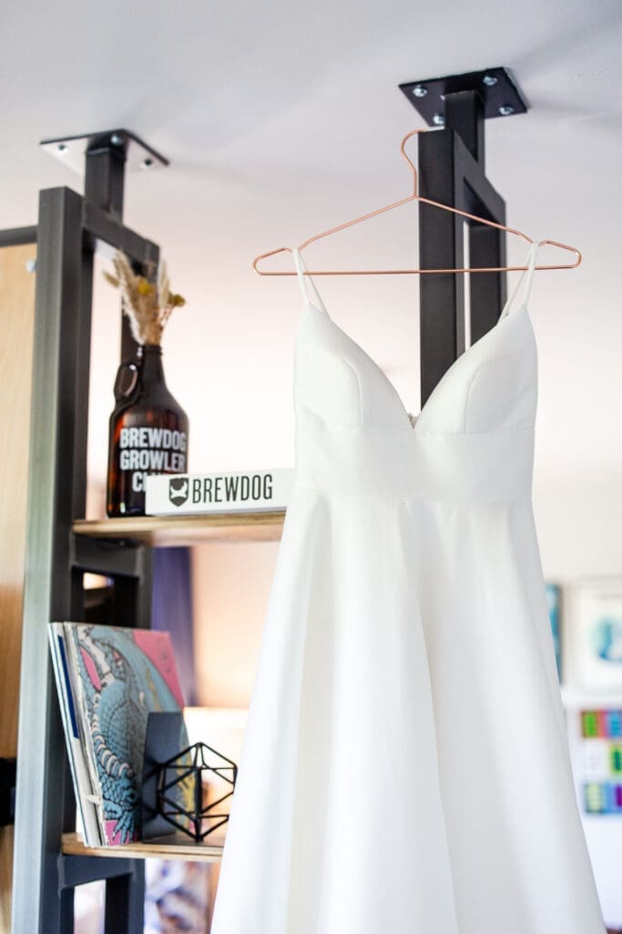 Hanging wedding dress inside a brewery hotel at BrewDog in Columbus, Ohio
