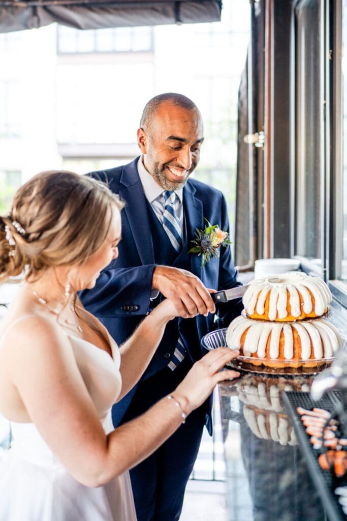 Bride and groom cut their Nothing Bundt Cake at the Grandview Cafe