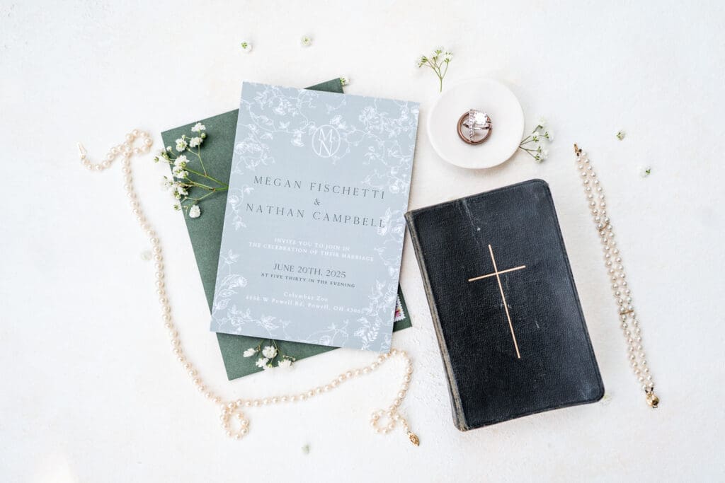 Flat lay including family heirlooms with a white and sage green theme.