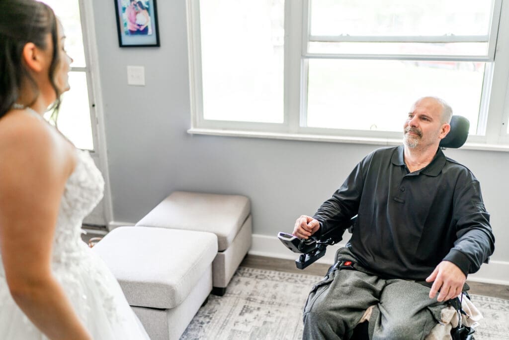 Emotional first looking between the bride and her dad with Parkinson's disease in Columbus, Ohio.