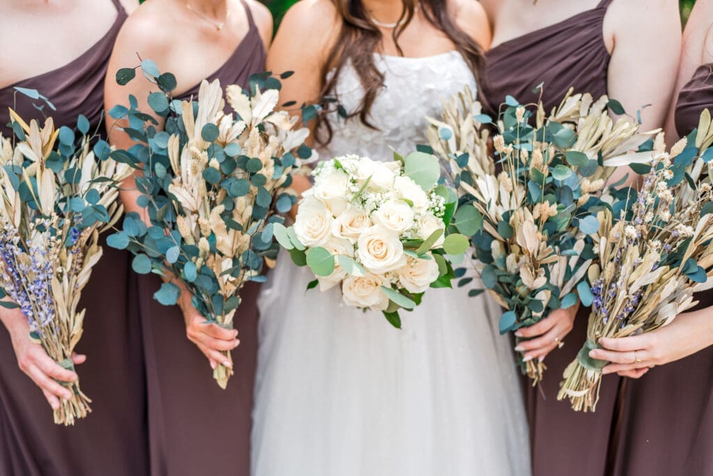 Dried wildflower bouquets and the bride's fresh white rose bouquet at the Columbus Zoo and Aquarium
