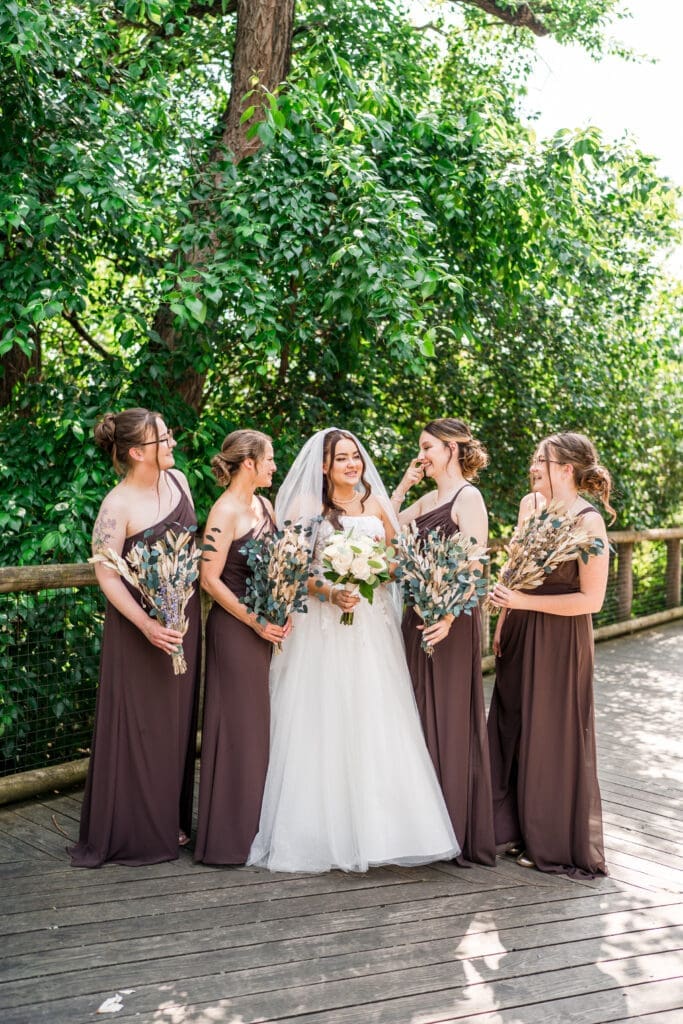 The bride and her bridesmaids dressed in brown at the Columbus Zoo and Aquarium