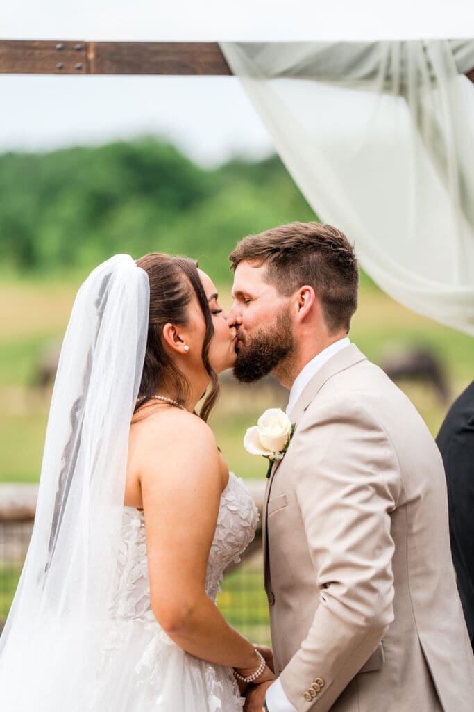 The first kiss at a wedding ceremony at the Columbus Zoo and Aquarium