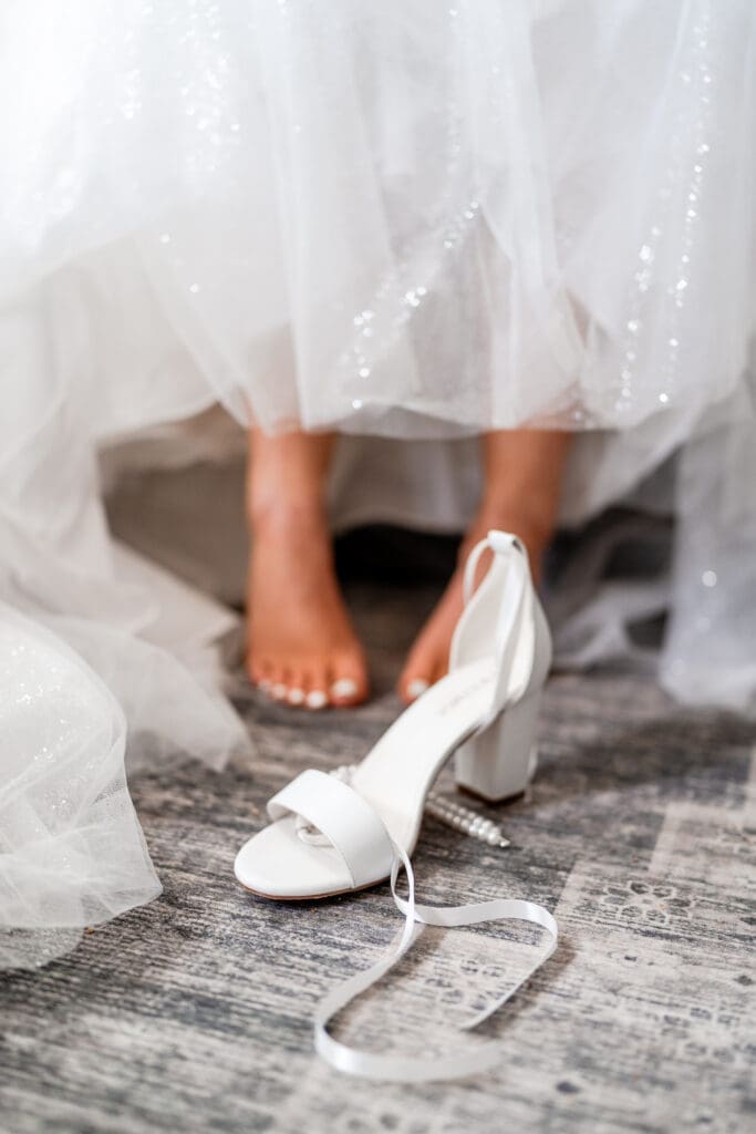 The bride's shoe in front of her feet