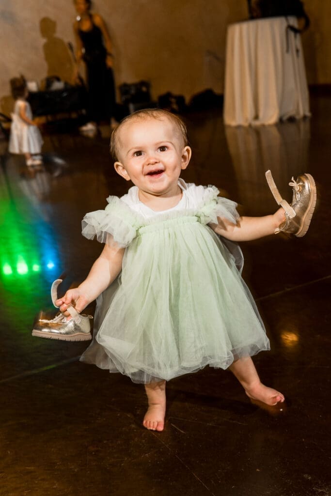 A cute kid dancing during the reception at the Columbus Zoo and Aquarium Africa Event Center