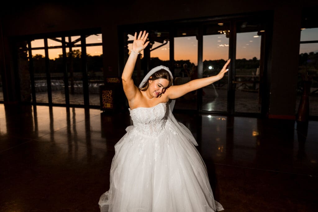 The bride dancing at the Columbus Zoo and Aquarium Africa Event Center