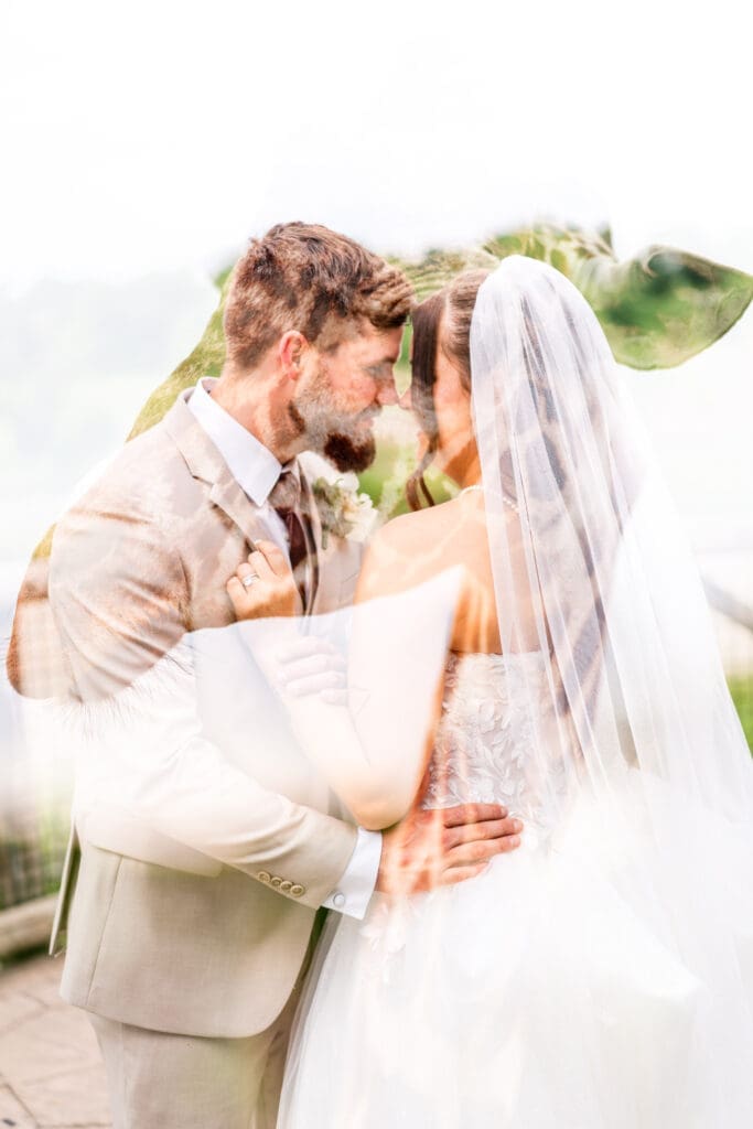 Creative double exposure of the couple framed by a giraffe at the Columbus Zoo and Aquarium