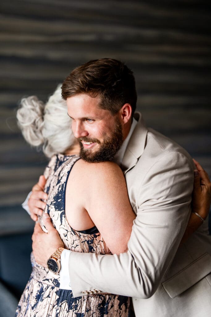 The groom hugging his mom
