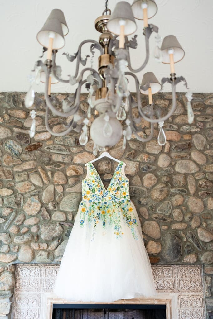 Colorful reception dress hanging on the fireplace at the Dempsey Event Center in Delaware, Ohio.