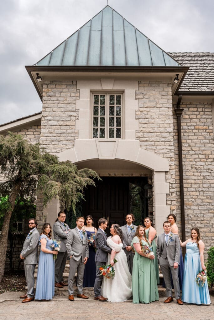 Editorial wedding party photo in front of the mansion at the Dempsey Event Center in Delaware, Ohio.