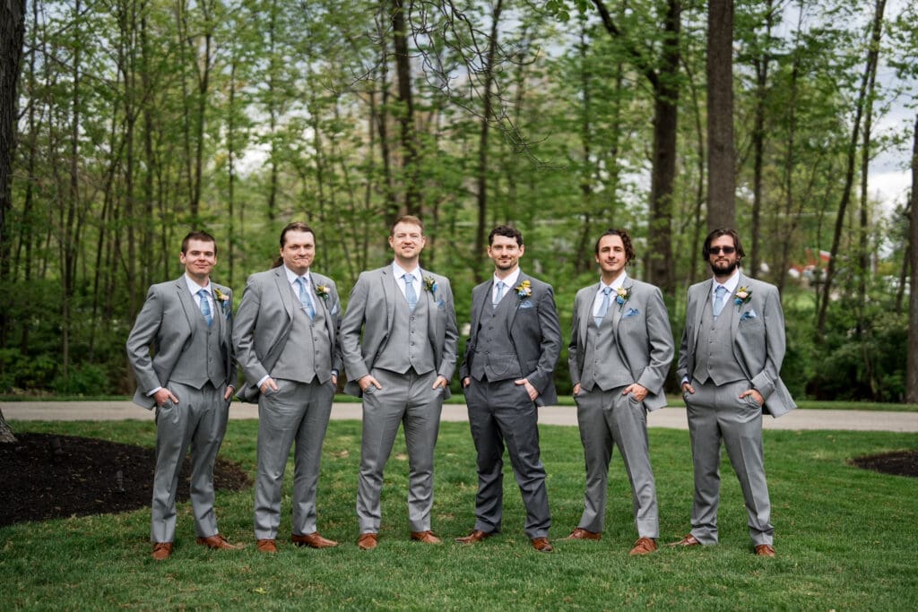 The groom and his groomsmen in gray suits at the Dempsey Event Center in Delaware, Ohio.