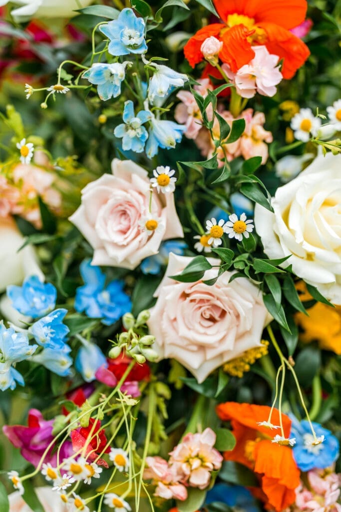 Colorful wildflower ceremony decor at the Dempsey Event Center in Delaware, Ohio.