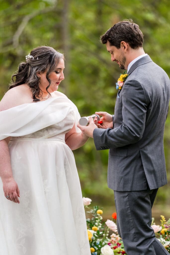 Bride and groom set the time on their time capsule right after their first kiss
