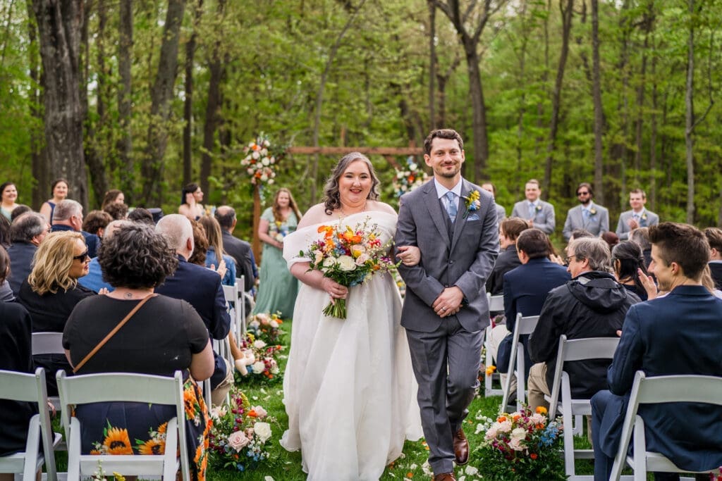A colorful wedding ceremony on the lawn at the Dempsey Event Center in Delaware, Ohio.
