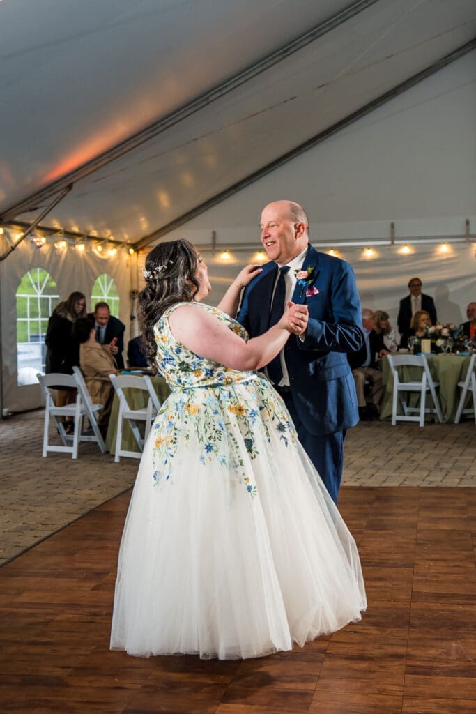 Father daughter dance at a tented wedding reception at the Dempsey Event Center in Delaware, Ohio.