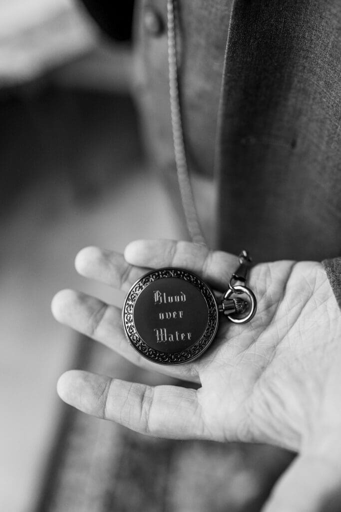 Detail photo of a pocket watch with an engraving on it