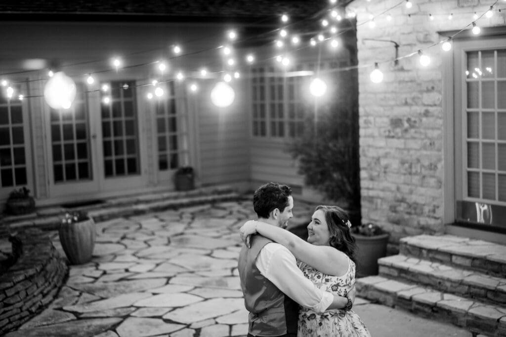 Nighttime wedding couple portrait under string lights at the Dempsey Event Center in Delaware, Ohio.